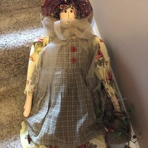 Beautiful beekeeper girl with bees in her hat and beehive hanging from her hand